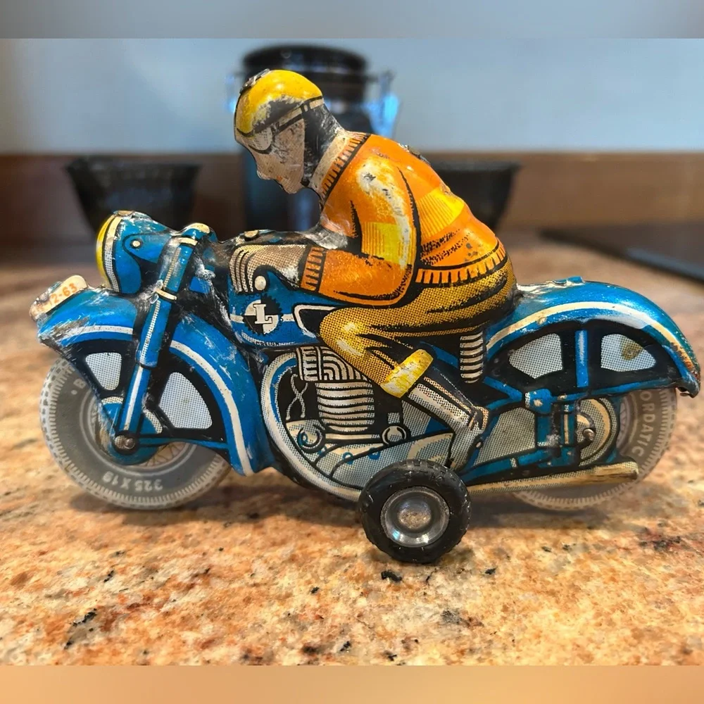 Tin Lithograph Friction Drive Ballon Cordatic toy cycle EN-12-63 Vtg 1950 Era.